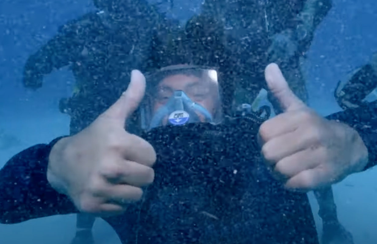 Sean McInerney, AKA Poopies, diving with sharks for Discovery's Shark Week (Photo: Discovery)