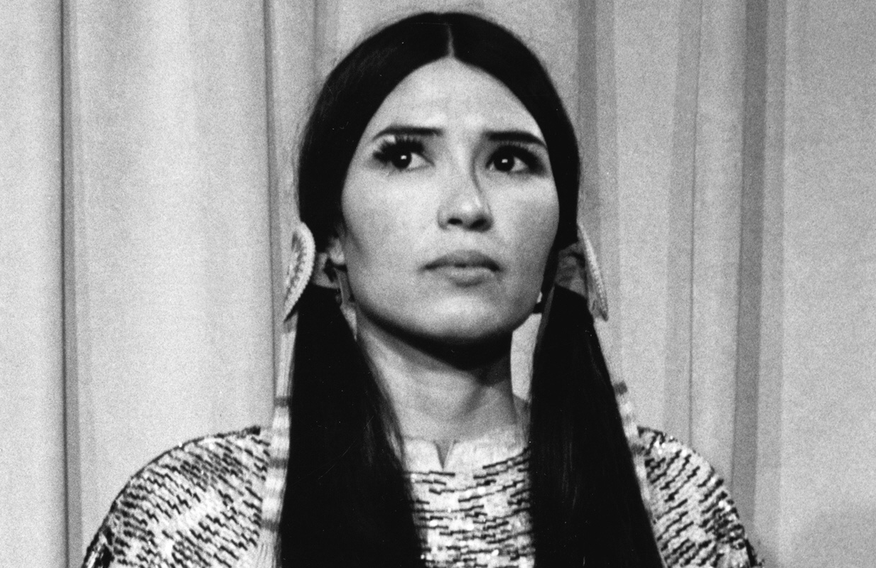 Sacheen Littlefeather onstage at the 1973 Oscars on behalf of The Godfather star Marlon Brando. (Photo: Everett Collection)