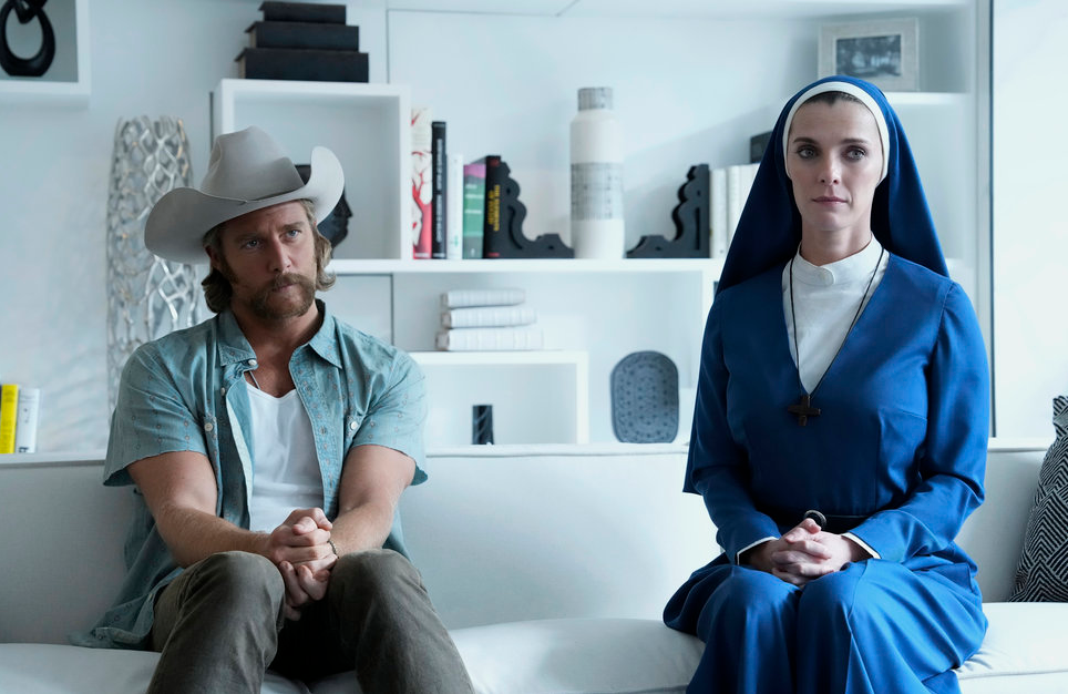 Jake McDorman and Betty Gilpin in Mrs. Davis (Photo: Greg Gayne/Peacock) 