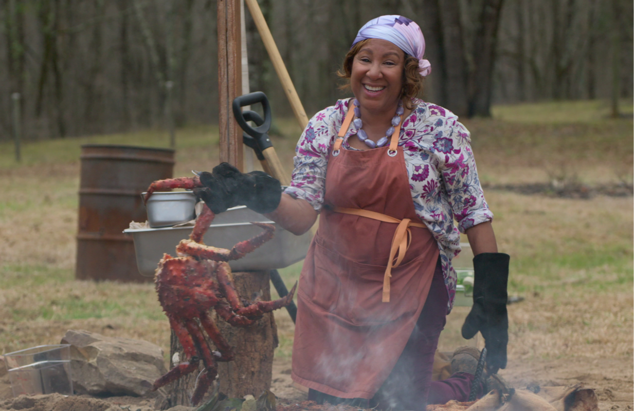 Delilah Winder (with a giant crab) on Barbecue Showdown (Photo: Netflix)