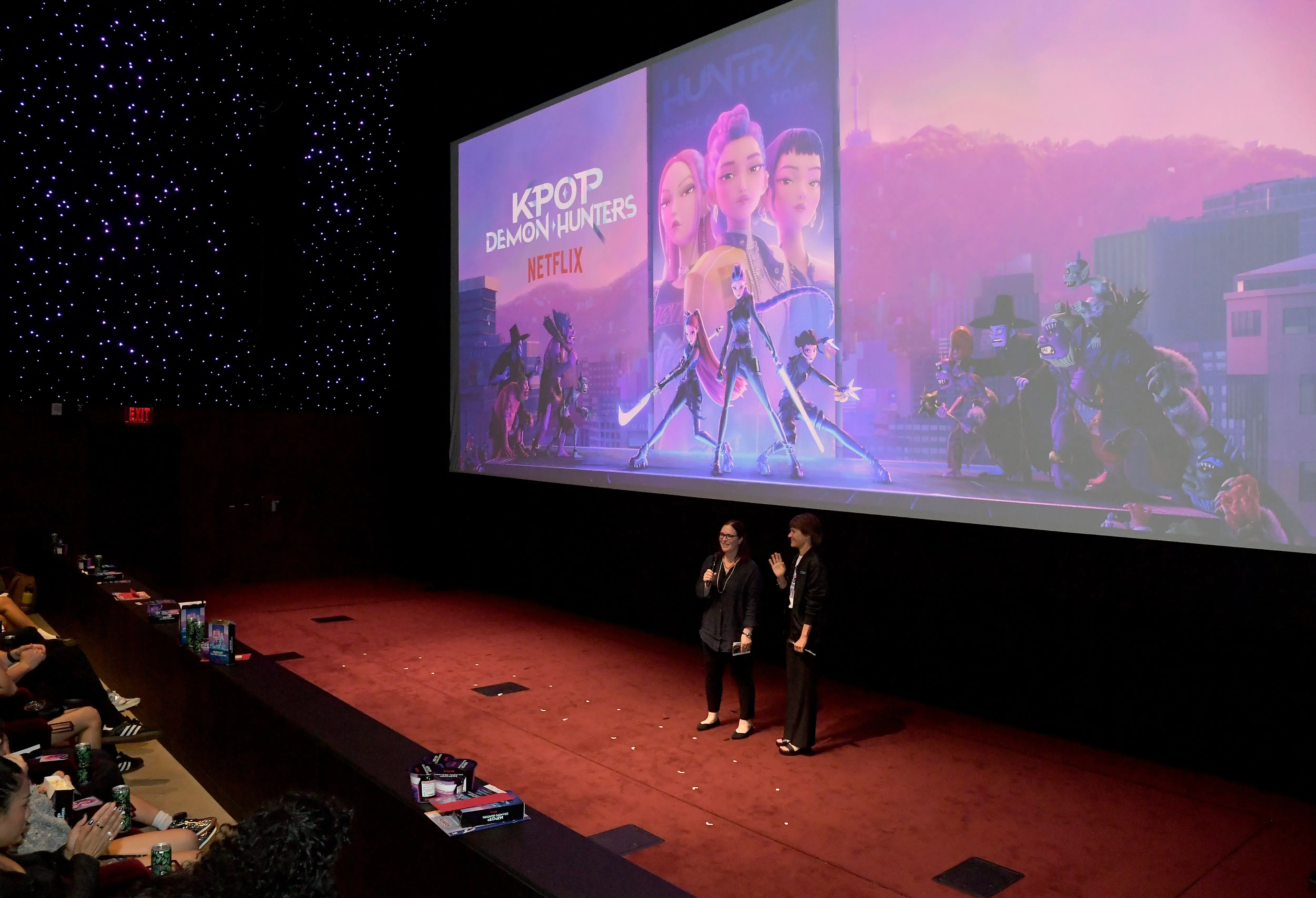 LOS ANGELES, CALIFORNIA - JUNE 16: (L-R) Hannah Minghella, Head of Feature Animation, Netflix and Kristine Belson, President, Sony Pictures Animation, speak during the KPop Demon Hunters Special Screening at Netflix Tudum Theater on June 16, 2025 in Los Angeles, California.  (Photo by Charley Gallay/Getty Images for Netflix)