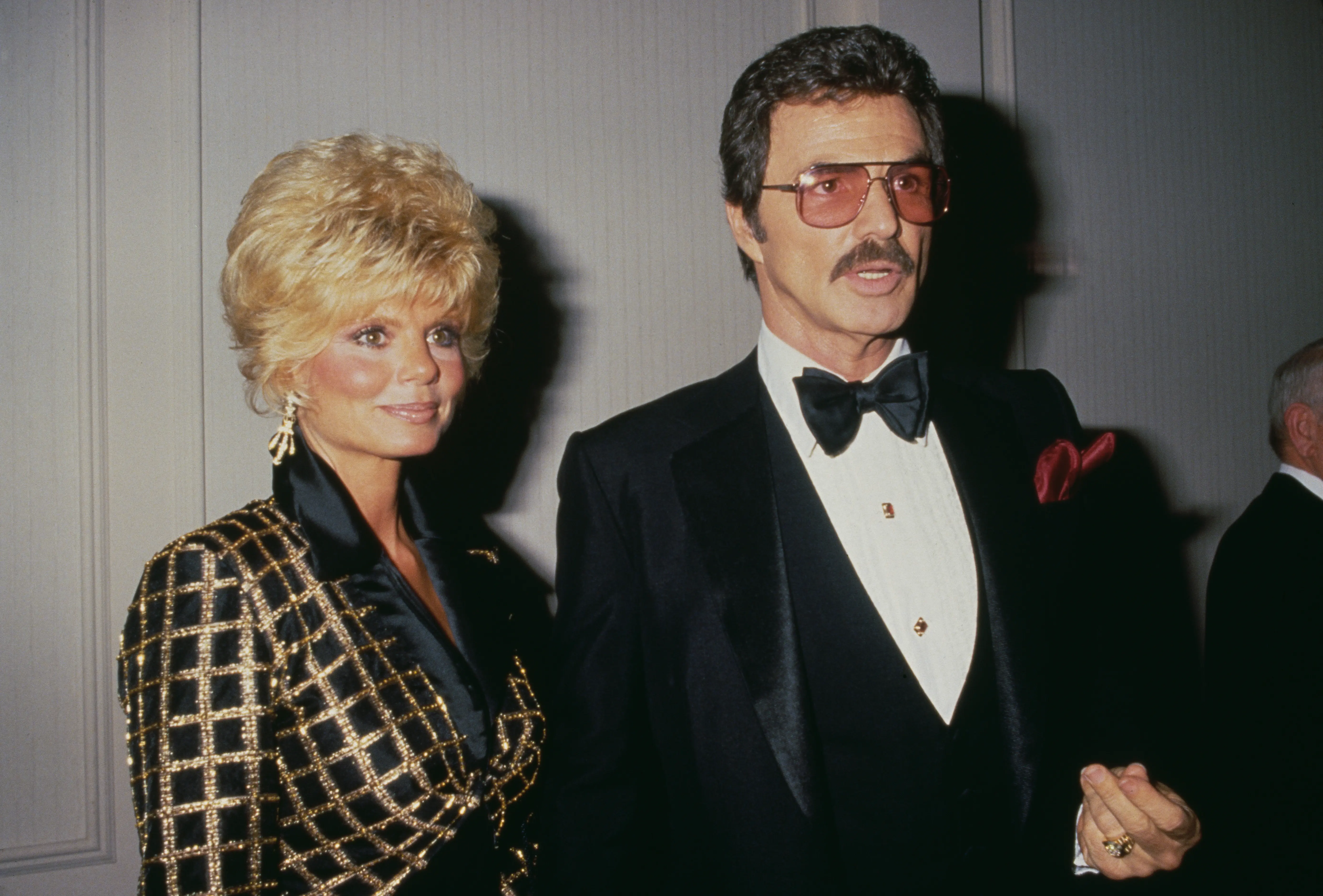 American actress Loni Anderson and American actor Burt Reynolds (1936-2018) attend the Friars Club of California's 8th Annual Lifetime Achievement Award Salute to Liza Minnelli, held at the Century Plaza Hotel in Los Angeles, California, 5th April 1987.  (Photo by Vinnie Zuffante/Getty Images)