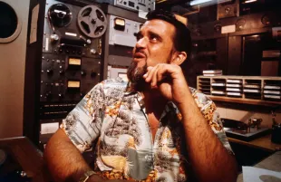 Wolfman Jack on the set of American Graffiti (Image via Getty)