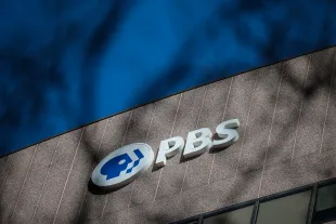 A sign for the Public Broadcasting Service (PBS) is seen on its building headquarters (Photo by Kayla Bartkowski/Getty Images)